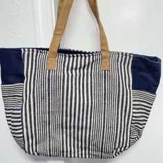 Nautical Navy Blue And White Tote Bag With Two Side Pockets, Small Inside Pocket (For Cellphone Or Keys), And Magnetic Clasps To Close. Tan Handles. Perfect For Purse, Diaper Bag, School Bag Or Work! Brand New! Chic Blue Canvas Shoulder Bag, Chic Blue Canvas Bag With Large Capacity, Chic Large Capacity Blue Canvas Bag, Chic Blue Canvas Bag For Travel, Chic Blue Cotton Bag, Chic Blue Rectangular Canvas Bag, Casual Striped Beach Bag For Everyday Use, Everyday Blue Canvas Beach Bag, Navy Bags For Everyday Summer Use