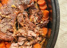 a pot roast with carrots and meat in it