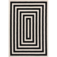 a black and white rug with an interlocked square pattern on the bottom half