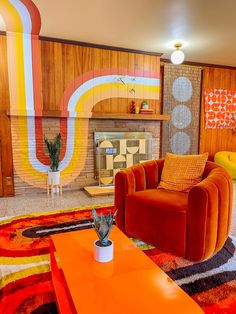 an orange couch and chair in a room