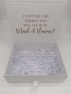 an open box with shredded white paper in it that says, i can't say i do without you will you be my maid of honor?