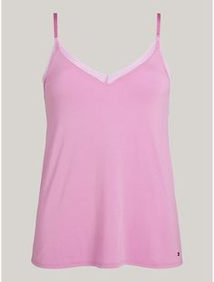 Tommy Hilfiger women’s sleepwear. This airy cami is woven from soft-washed fabric that feels like a dream against the skin. Even better with delicate lace trim.  Material: 95% Sustainable Modal (smd), 5% Elastane. Feminine Seamless Camisole For Loungewear, Feminine Seamless Cotton Camisole, Feminine Spaghetti Strap Tank Top For Loungewear, Feminine Cotton Camisole With Spaghetti Straps, Spring Camisole With Built-in Bra For Relaxation, Feminine Camisole Tank Top For Loungewear, Spring Modal Sleepwear, Solid Color Camisole For Relaxation, Feminine Cami Top For Loungewear