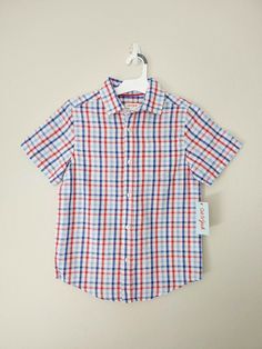 Cat & Jack Boys' Americana Short Sleeve Button-Down Shirt White/Blue/Orange Fit & style     Model wears size M     Boys' collared shirt adds a timeless vibe to his everyday ensembles     100% cotton construction allows all-day soft, breathable comfort     Pairs easily with a variety of bottoms for versatile styling Description This Americana Short-Sleeve Button-Down Shirt from Cat & Jack™ is sure to be his go-to choice every time he steps out of the house.  A must-have staple, this boys' button- Orange Short Sleeve Shirt With Buttons, Orange Cotton Shirt With Button Closure, Orange Button Closure Shirt For Summer, Orange Summer Shirt With Button Closure, Orange Button-up Shirt With Button Closure, Orange Cotton Summer Shirt, Summer Orange Cotton Shirt, Classic Orange Summer Shirt, Orange Short Sleeve Shirt For Spring