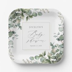 a square paper plate with greenery on it and the words, joy to everyone