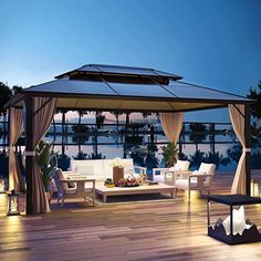 an outdoor living area with furniture and lights