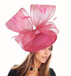 Hats By Cressida Kentucky Derby & Ascot Fascinator Hats Emmarentia Fascinator Hat Pretty 3d bow on a 12 inch wide sinamay base Bow measures about 14 inches wide and 8 inches high Mounted with a matching headband. If you prefer a headband to match your hair, please make a note at check out what colour headband you want. We make each hat to order just for you, we would prefer if you did not order for choice. If colour match is important to you please ask for free fabric swatch to be sent to you - this reduces returns and disappointment.   We can also make a custom design for you if you have something else in mind.  RETURNS: We accept returns ONLY within 7 days of receipt.  There will be no exceptions to this policy.  If you have a problem with your order, please contact us as soon as you rec Wedding Hats With Bow And Short Brim, Pink Bow Hat For Spring, Elegant Pink Hat With Bow, Pink Cloche Fascinator For Party, Curved Brim Mini Hat With Bow For Party, Pink Curved Brim Boater Hat For Party, Spring Party Fascinator With Bow, Pink Boater Hat With Curved Brim For Party, Pink Party Boater Hat With Curved Brim