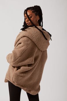 When temps drop, you cocoon up. Designed with a luxe faux sherpa fabric, the Cocoon Coat makes layering a breeze (ironic, right?). Pair with your go-to jeans or workout ootd. Cozy Fleece-lined Outerwear For Loungewear, Cozy Fleece-lined Loungewear Outerwear, Fall Sherpa Outerwear For Loungewear, Sherpa Outerwear For Fall Loungewear, Casual Outerwear With Faux Fur Lining, Cozy Relaxed Fit Hooded Outerwear, Comfy Oversized Winter Outerwear, Fall Outerwear With Faux Fur For Loungewear, Oversized Comfy Fall Outerwear