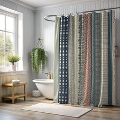 a bathroom with a bathtub, rug and shower curtain in front of the window