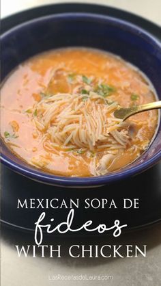 mexican soup with chicken in a blue bowl