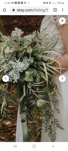 an image of a bride holding her wedding bouquet with greenery and foliage on it