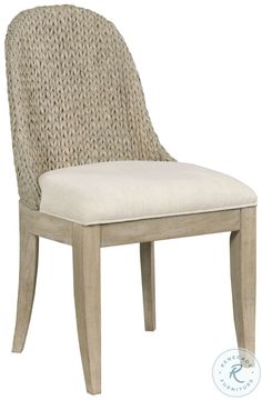 an upholstered chair with a white cushion