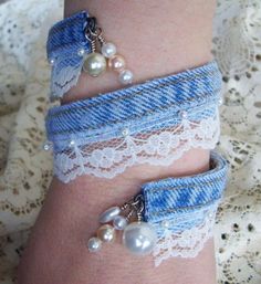 a woman's arm with two bracelets on it and pearls attached to the wrist