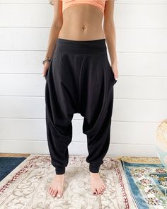 "Black Harem Pants, Yoga Dhoti Pants, Samurai Ninja Pants. Great as a casual wear, these pants are not as baggy as the original glorkas. Yet they are still super comfortable and made from the softest pleasant cotton blend. -Unisex -Stretch -Flowing relaxed fit -Inner drawstring to secure the waist -2 side pockets Wear it for Yoga, Dance, Exercises, Meditations, Yoga Practice and beyond... Materials: black color cotton blend (95% cotton 5% lycra). Fabric for this pair were bought in Fashion Distr Avant Garde Pants, Dance Exercises, Ninja Pants, Samurai Ninja, White Yoga Pants, Samurai Pants, Yoga Pants Men, Cotton Harem Pants, Black Harem Pants