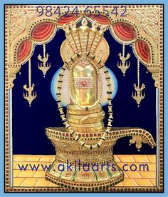 the golden statue is on display in front of a blue background with red and yellow accents