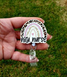 This cute Nicu Nurse rainbow Badge Reel measures aprox 2 inches. It is printed on a very sturdy hardboard. And is attached to a retractable badge reel Available in Alligator or Belt Clip Customizable White Novelty Craft Supplies, Cute Customizable White Craft Supplies, White Novelty Craft Supplies For Gifts, Novelty White Craft Supplies For Gifts, Customizable White Craft Supplies For Hobby, Customizable White Badge Reel For Gift, Personalized White Badge Reel As Gift, Personalized White Craft Supplies For Gift, Customizable White Badge Reel For Crafting