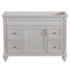 a white bathroom vanity with drawers and doors