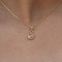 Dainty 14K gold filled CZ solitaire pendant necklace. The Cubic zirconia stone is wrapped in gold filled and hanged on a 14K gold filled necklace. Gemstone is available in a few colors. This delicate women solitaire jewelry fits any outfit or occasion day or night. Classic little bezel necklace that gives an elegant touch to your daily outfit. All components are nickel free. ◆ DETAILS  Chain: 14K gold filled Pendant: CZ stone (cubic zirconia) wrapped in 14K gold filled - 0.31"x0.31" (=8mm X 8mm) Charm Color: Clear (transparent) , Red, Light green, Lavender Length: 16" inch to 20" inch 14 inches (35.5 cm): choker that wrap high around the neck 15 inches (38 cm): closely around the neck 16 inches (40.5 cm): at neckline 17 inches(43 cm): average length 18 inches (45.5 cm): at collar bone 19-2 Gold Cubic Zirconia Crystal Pendant Necklace, Gold Cubic Zirconia Pendant Necklace, Gold Birthstone Necklace Fine Jewelry, Gold Fine Jewelry Birthstone Necklace, Gold Birthstone Necklace With Round Stone, Gold Round Stone Birthstone Necklace, Elegant Gold Crystal Necklace For Anniversary, Gold Dainty Crystal Necklace With Cubic Zirconia, Gold Dainty Cubic Zirconia Crystal Necklace