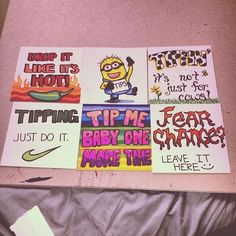 four posters with different sayings on them sitting on a bed next to a pillow