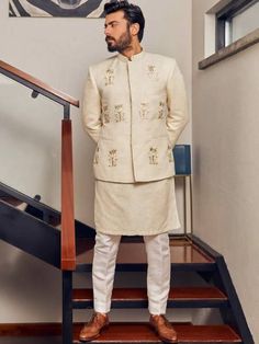 <p>Color: Off-White<br />Fabric: Jamawar<br />Stylish prince coat features rich quality embellishments accentuate on the front<br />Hidden front hooks closure<br />Complement with matching kurta and pajama</p> <p> </p> <p><strong>Additional Accessories:</strong> </p> <p><strong>Plain Kolhapuri/Saleem Shahi shoes:</strong> US$30 (Made with prince coat material)</p> <p><strong>Note:</strong> Price of all prince coat suits includes only 3 pieces i.e. prince coat, kurta/kameez and shalwar/pajama (or Festive Designer Nehru Jacket With Stand Collar, Designer White Nehru Jacket, Bandhgala With Chikankari Embroidery For Eid, Eid Bandhgala With Chikankari Embroidery And Stand Collar, Designer Nehru Jacket Straight Kurta For Festive Occasions, Festive Designer Kurta With Stand Collar, Designer Festive Kurta With Stand Collar, Designer Stand Collar Kurta For Festive Occasions, Designer Nehru Jacket For Festive Occasions