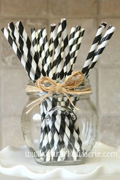 black and white striped paper straws in a mason jar