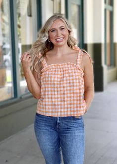 Get checked out in the Hannah Gingham Top! This stylish piece comes with tie straps and a square neckline that's perfect for sunny days. Oh, and the gingham print? A timeless classic. So, grab your sunnies and take on the day in style! For longer fit, size up. Plaid Summer Tops For Day Out, Summer Plaid Tops For Day Out, Plaid Tops For Summer Day Out, Everyday Plaid Summer Tops, Plaid Tops For Everyday Summer Wear, Summer Casual Tops With Grid Pattern, Trendy Plaid Tops For Summer, Casual Grid Pattern Tops For Summer, Casual Summer Tops With Grid Pattern