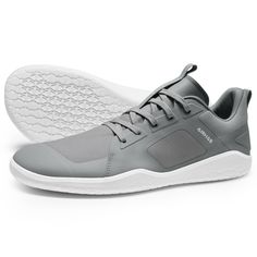 a pair of grey sneakers with white soles