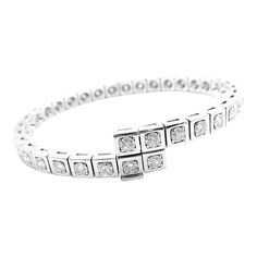 Authentic Cartier Tectonique 18k White Gold Diamond Tennis Bracelet       About Cartier: The company has a long and distinguished history of serving royalty, as well as stars and celebities. One Prince of Wales hailed Cartier as "Joaillier des Rois, Roi des Joailliers" (Jeweller to Kings, King of Jewellers"). Cartier received an order for 27 tiaras for the coronation of the future King. King Edward VII was crowned in 1902 and in 1904 he honoured the Company with the Royal warrant of supplier to Classic Cartier Diamond Bangle Bracelet, Cartier Classic Diamond Bangle Bracelet, Classic Cartier Bracelets For Wedding, Classic Cartier Diamond Bracelet, Classic Cartier Diamond Bracelet With Accents, Classic Cartier Diamond Bracelet With Diamond Accents, Cartier Classic Diamond Bracelet With Diamond Accents, Cartier White Gold Jubilee Bracelet, Classic Cartier Bracelet With Single Cut Diamonds