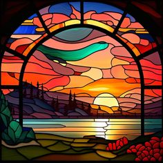 a stained glass window with the sun setting over water and mountains in the background,