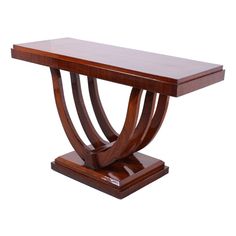 a wooden table with an unusual design on it's top and bottom, against a white background