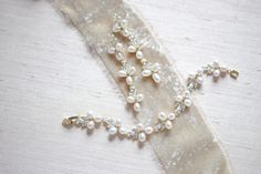 "Featuring a gorgeous combination of crystals and freshwater pearls, this bracelet and earrings set is the perfect piece to add to your bridal look for a touch of vintage meets modern glam! - Bracelet measures 6\" x 0.5\" - Earrings measure 2.5\" x 0.5\" - Made with high quality cubic zirconia and freshwater pearls - Available in rose gold, yellow gold and rhodium (silver) finishes Browse My Entire Shop For More Jewelry & Accessories: https://www.etsy.com/shop/TheExquisiteBride Browse My Sho Elegant Wedding Jewelry Sets With Bracelet Shape, Elegant Wedding Jewelry Sets With Bracelets, Wedding Elegant Jewelry Sets With Bracelet, Elegant Wedding Jewelry Sets Including Bracelet, Elegant Rose Gold Pearl Bracelet For Wedding, Rose Gold Pearl Bracelets For Wedding, Wedding Pearl Bracelets In Rose Gold, Dainty Rose Gold Pearl Bracelet For Wedding, Delicate Pearl-embellished Jewelry For Mother Of The Bride