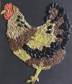 a chicken made out of grains on a black board