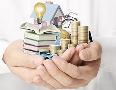 a person holding stacks of coins and an open book with a light bulb on top