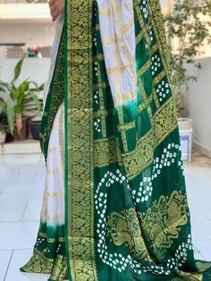 New Super Hit Bandhani Saree With Premium Products  HEAVY CHEX GHARCHOLA 🔥Fabric:- Art Silk With Zari Waving 🔥Awesome Heavy Zari Waving  Saree 🔥Work :~ Hend Bandhej 🔥100% Orignal Bandhej Saree Bandhani, one of the oldest known methods of tie-dyeing, is still widely practiced in western India today. The fabric is made by pinching very small portions of cloth and tying them by plucking the cloth with the fingernails into many tiny bindings that form a figurative design to form an intricate pat Bollywood Style Traditional Wear With Batik Print For Navratri, Bollywood Style Batik Print Traditional Wear For Navratri, White Bandhani Traditional Wear For Festivals, White Bandhani Print Traditional Wear For Festivals, Transitional Green Bandhani Print Dupatta, Bollywood Style White Bandhani Traditional Wear, Green Bandhani Print Traditional Wear For Transitional Season, Transitional Green Bandhani Traditional Wear, White Bandhani Print Traditional Wear For Navratri