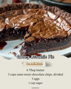 there is a chocolate pie on the plate with words below it that read gooey brownie pie