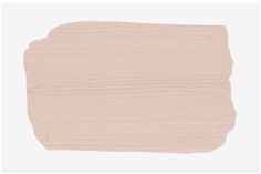 a light pink paint swatch on a white background