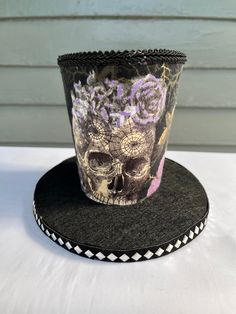 This Mini halloween mini top hat will dress up your Halloween decor or make your halloween wreath truly unique. Made from foam and fabric. This is not a sewn product only hot Glue was used so handle with a little care. I added black trim. It has a belt Around the bottom of the hat above the brim and i added a cameo. Only one available. This hat is 7 inches tall. The brim is wired so you can shape it however you want it. Direct sunlight will fade it. Check out my Facebook page Bulldogmom2 Creations and give me a like to see what I create and to check out other reviews. Halloween High Crown Top Hat For Themed Events, High Crown Top Hat For Halloween Themed Events, High Crown Top Hat For Halloween, Themed High Crown Top Hat For Halloween, Whimsical Halloween Costume Hats And Headpieces As Gift, Themed High Crown Top Hat For Festivals, Festival Themed High Crown Top Hat, Whimsical Top Hat For Halloween Themed Events, Halloween Mini Hats As Gifts