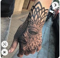 a person's hand with a tattoo on it that has an image of a woman's face