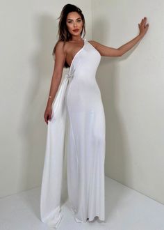 Made for moments of dramatic entrance, this maxi dress is crafted from luxuriant, lightweight fabric and comes with a breathtaking train and an o-ring detail that will turn heads. Feminine and elegant, its backless design and silhouette will make it a timeless piece in your wardrobe. Fit Type: Regular Fit Fabric: High Stretch Material: Polyester, Elastane Luxury Fitted Backless Maxi Dress, Chic Flowy Maxi-length Backless Dress, Elegant Backless Maxi Dress Beach Cover-up, Fitted White Backless Maxi Dress, Chic Backless Maxi Dress Beach Cover-up, Convertible Maxi Dress, Black Hot Pink, Black White Red, Elegant Dress