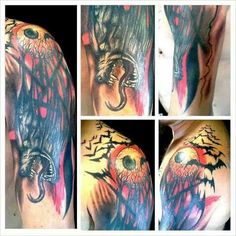 tattoos on the arm and shoulder are all done in different colors, including black and grey