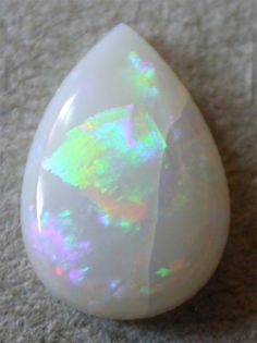 White Opal White Opal Stone Meaning, White Gemstones, Opal Stone, Opal Symbolism, Opal Aesthetic Gem, Opal Crystal Meaning, White Crystals, Opal White, Pretty Rocks