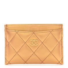 This is an authentic CHANEL Metallic Lambskin Quilted CC Card Holder in Gold. This simple cardholder is crafted of luxurious diamond quilted lambskin leather in metallic gold. It features a gold Chanel CC logo on the front pocket and card slots on either side of the main compartment. Cc Card, Gold Chanel, Chanel Wallet, Diamond Quilt, Card Holder Wallet, Cc Logo, Lambskin Leather, Metallic Gold, Front Pocket