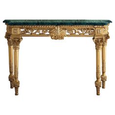 an ornately decorated console table with green marble top