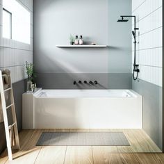 a white bath tub sitting under a window next to a ladder