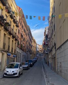 cars parked on the side of an empty street