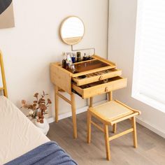 a bedroom with a vanity and stool in it