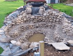 an outdoor fire pit made out of rocks