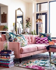 a living room filled with lots of furniture and decor