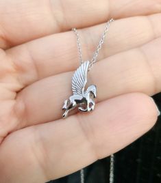 "Silver Pegasus Necklace Winged Flying Horse Pendant on Chain Greek Mythology Jewelry Fairytale, Fantasy Themed Mystical Valentines Gift for Her Material925 Sterling Silver PlatingRhodium/ same as for solid white gold                                               Purpose: looks same as white gold and protects silver from natural tarnishing                                               NICKEL FREE FinishingHigh Polished/ Shiny Height down18mm Width across11mm ChainCable, Diamond Cut Pegasus Necklace, Greek Mythology Jewelry, Mythology Jewelry, Flying Horse, Valentines Gift For Her, Horse Pendant, Horse Necklace, Fairytale Fantasy, Horses Pendant