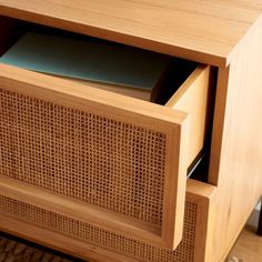 a close up of a wooden cabinet with drawers