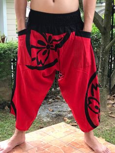 "Male Model Tall 5'9\" Waist 34\" Samurai Pants - elastic waistband Fits all! Unisex pants These beautiful casual pants is unique & comfortable to wear Handmade with a very lovely pattern, it is easy to wear and great for many occasions. One size fits most. These pants are great for many different activities like traveling, dancing, going to festivals, rock climbing, yoga, meditation, massage, working out, martial arts, Taichi MATERIAL: 100% Cotton APPROX MEASUREMENT: Waist: 24\"- 40\" Lengt Casual Yoga Pants With Pockets For Festivals, Casual Pants With Pockets For Festivals, Casual Wide Leg Harem Pants For Festivals, Casual Festival Pants With Pockets, Casual Wide Leg Bottoms For Festivals, Casual Baggy Harem Pants For Festivals, Casual Pants With Elastic Waistband For Festivals, Casual Wide Leg Pants For Festivals, Casual Festival Trousers